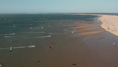 kitesurfing water sports in brouwersdam, netherlands - aerial drone shot