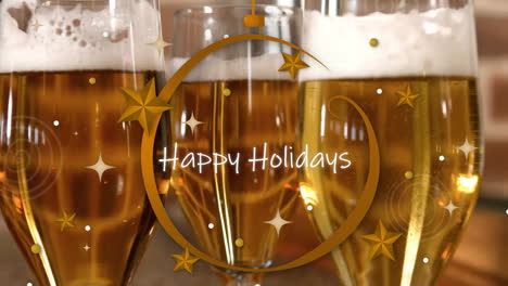 Happy-Holidays-text-animation-over-glasses-of-beer-with-festive-decorations