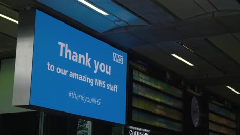 static shof of the thank you nhs sign inside an empty st pancras international station