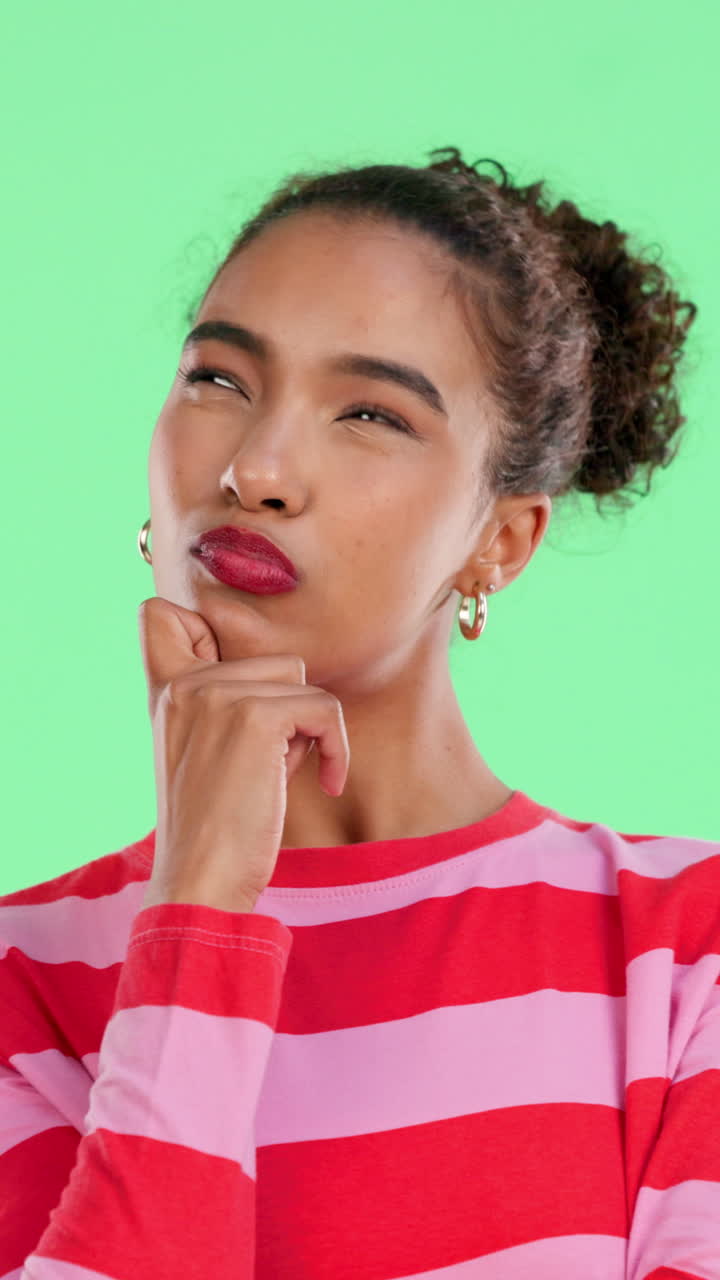 Thoughtful Young Woman Contemplating an Idea on Green Screen