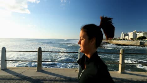 female jogger jogging on seaside 4k