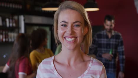 Woman-looking-at-camera-and-smiling