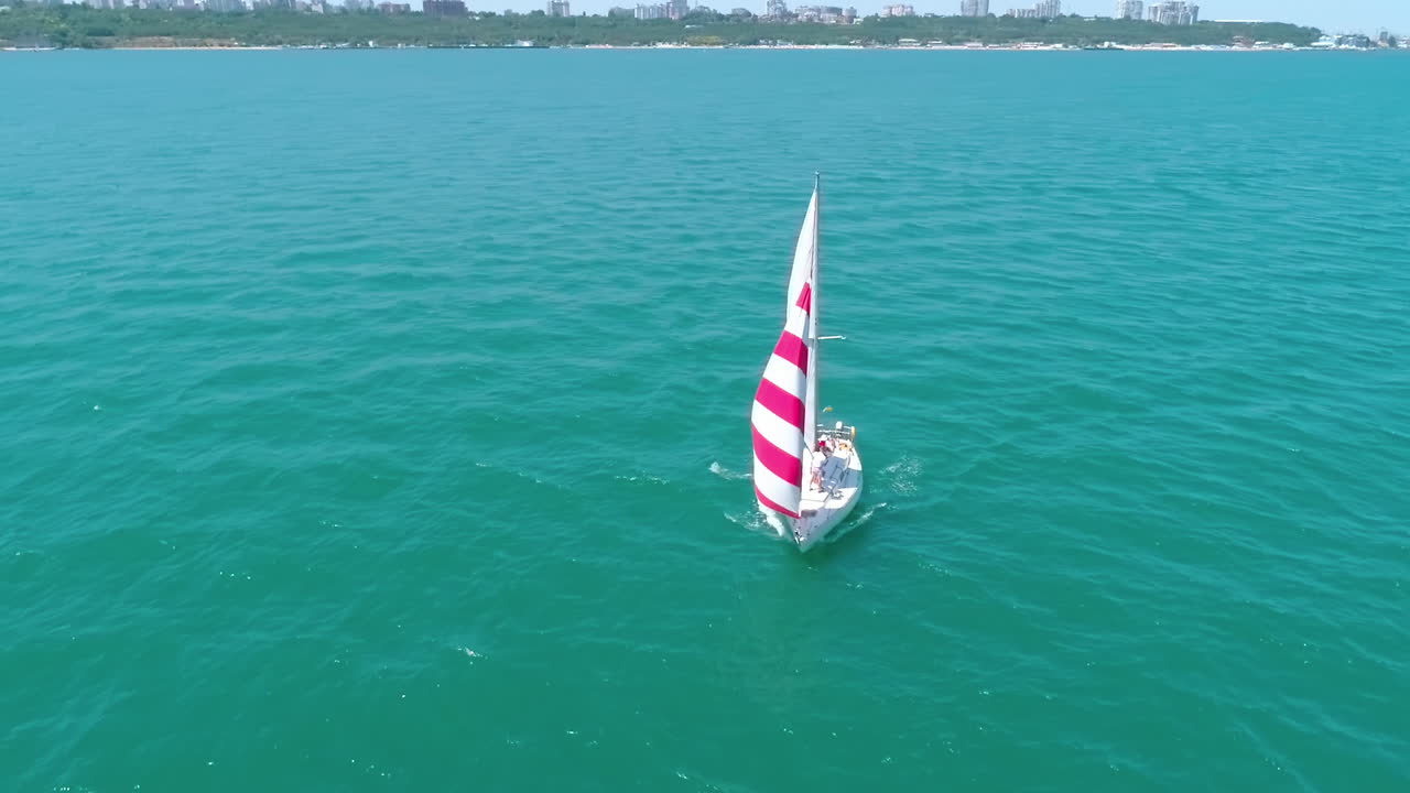 Sailing boats in the sea. Aerial drone view of floating sailing yachts in sea