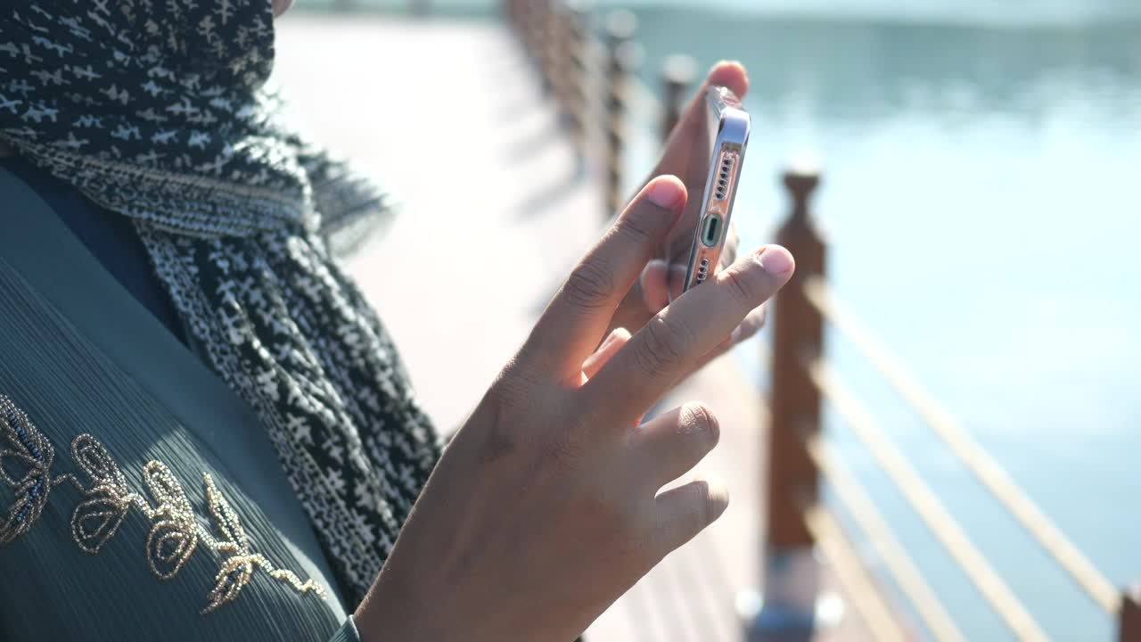 Woman using smartphone outdoors