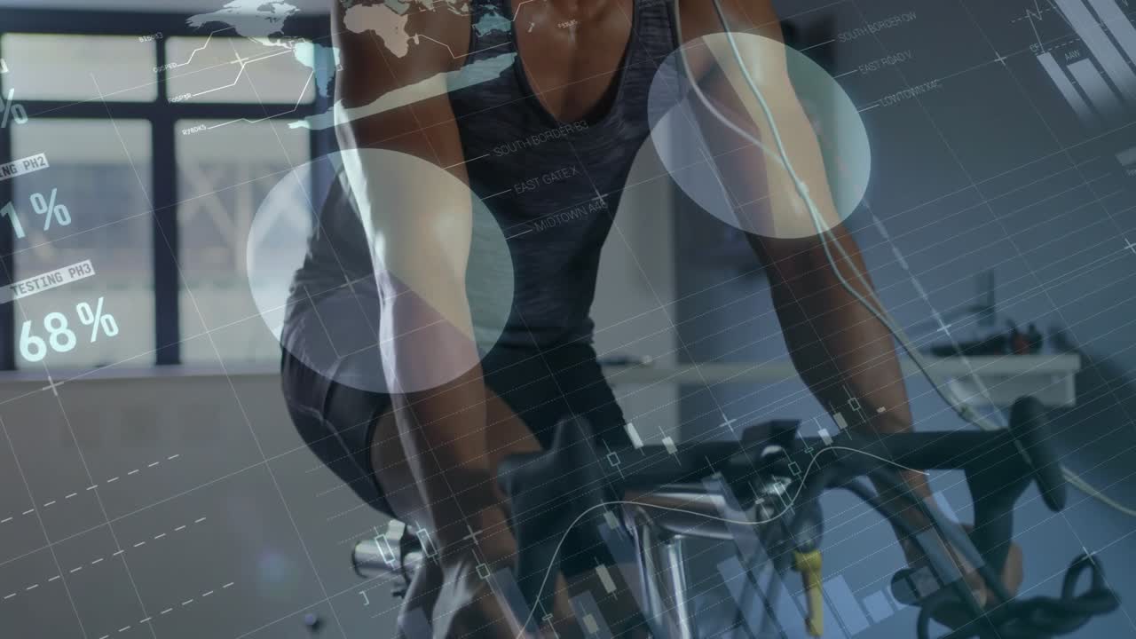 Male athlete gripping handlebars and pedaling in sports lab for testing data charts updating stats
