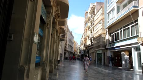 a lively city street showcases stunning historical buildings, with people strolling and admiring the architectural beauty, capturing the charm and essence of the city’s heritage.