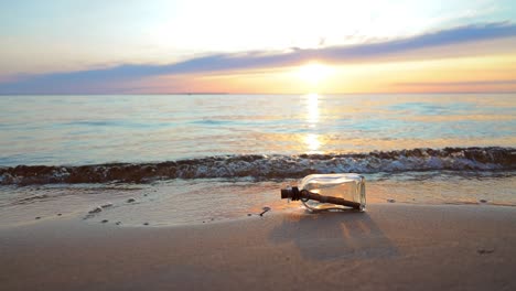 Message-in-the-bottle-against-the-Sun-setting-down