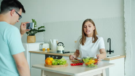 couple making a healthy vegetable salad