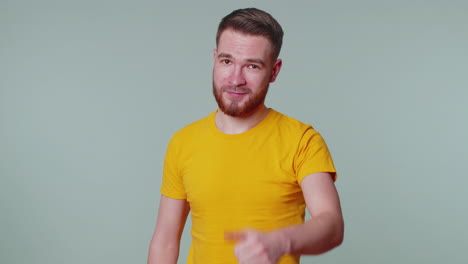 Bearded-man-raises-thumbs-up-agrees-or-gives-positive-reply-recommends-advertisement-likes-good