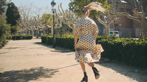 stylish young woman running in the park.