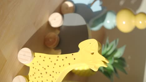 wooden yellow giraffe toy on wheels
