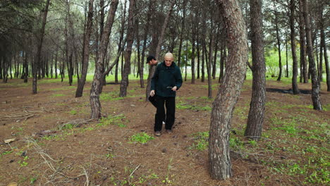 two men walking in the natural woods of italy