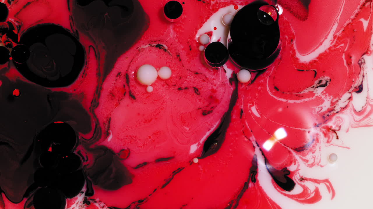 Red and cream colored acrylic paint mix, abstract fluid art background with Valentine's Day color scheme