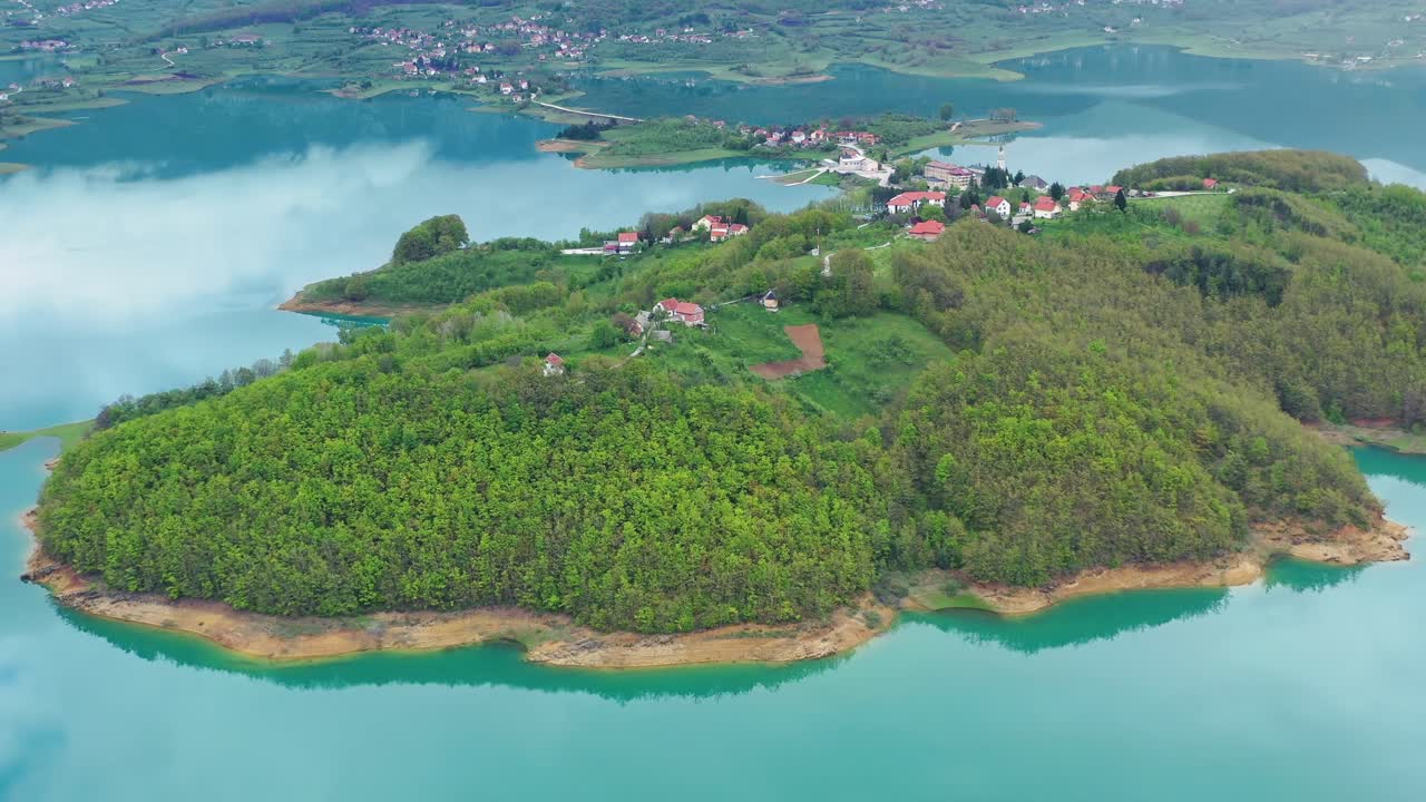 Lush greenery island at unspoiled Rama Lake. Scenic aerial
