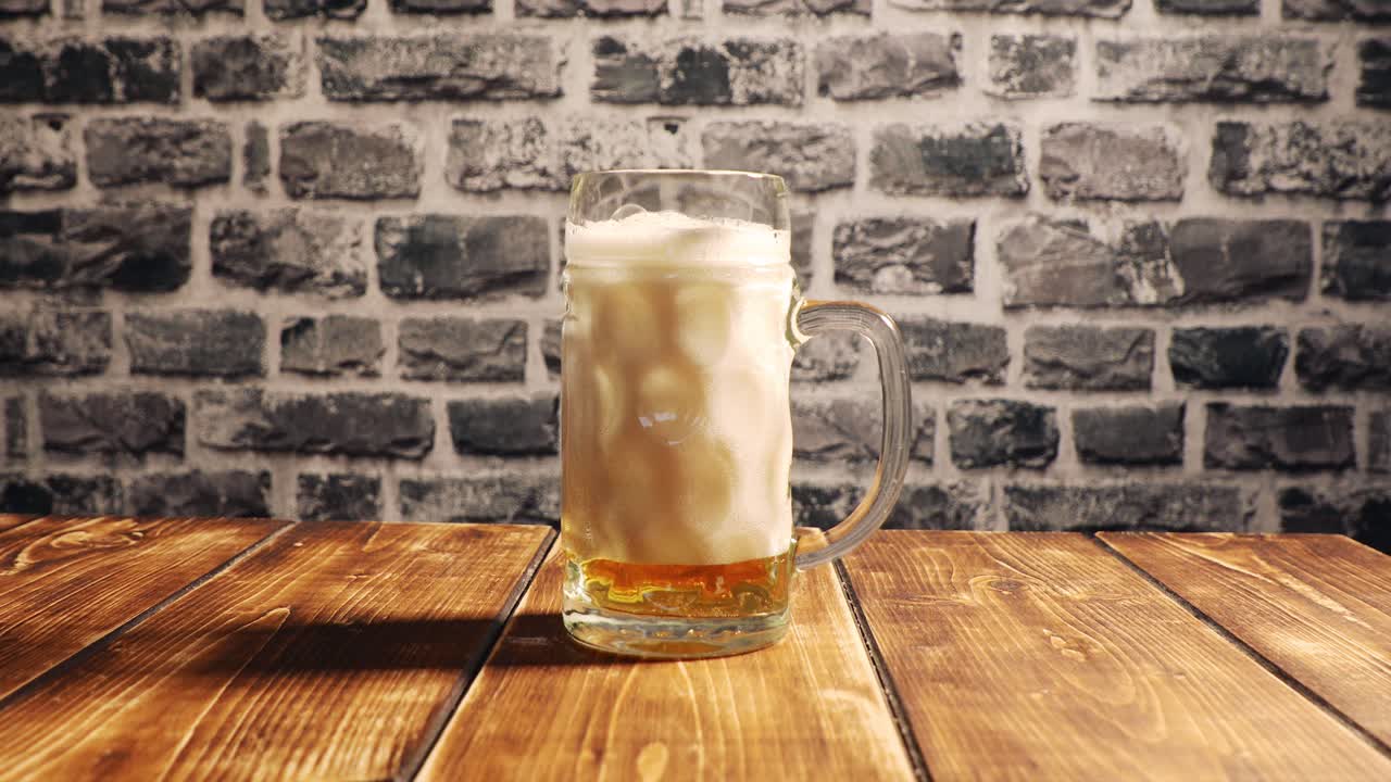Pouring a glass of beer wrong with foam filling up and slowly settling down