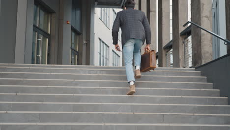 businessman walking up stairs