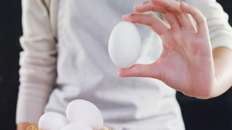 woman holding white eggs 4k