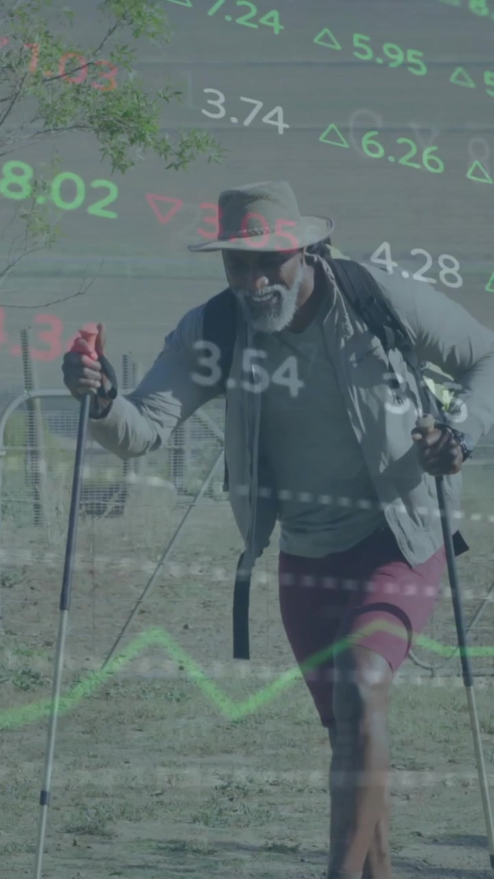 Animation of financial data processing over african american man walking in nature