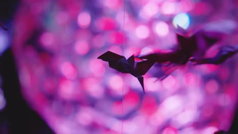 origami fish hanging, focus reveal of goldfish tank at ginza, tokyo japan