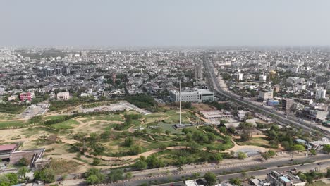 aerial drone shot of indian flag waving in jaipur city where traffic and crowded buildings located