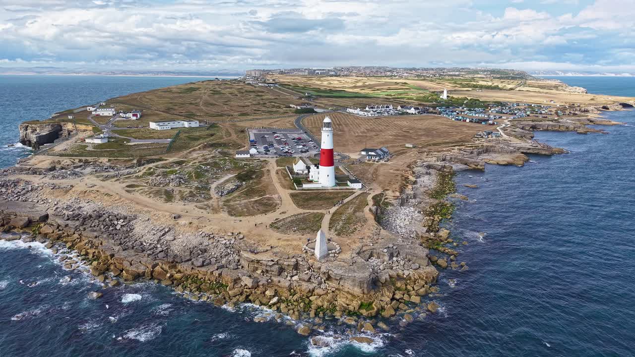 The famous Portland Bill lighthouse and rocky coastline of the Isle of Portland, UK