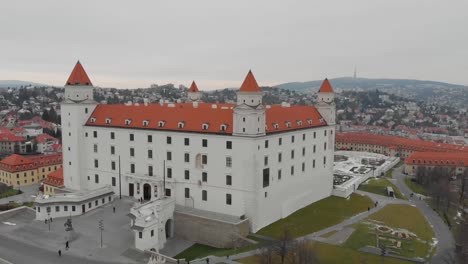 Bratislava-Castle-The-massive-rectangular-building-with-four-corner-towers-stands-on-an-isolated-rocky-hill-of-the-Little-Carpathians-directly-above-the-Danube-river-in-the-middle-of-Bratislava