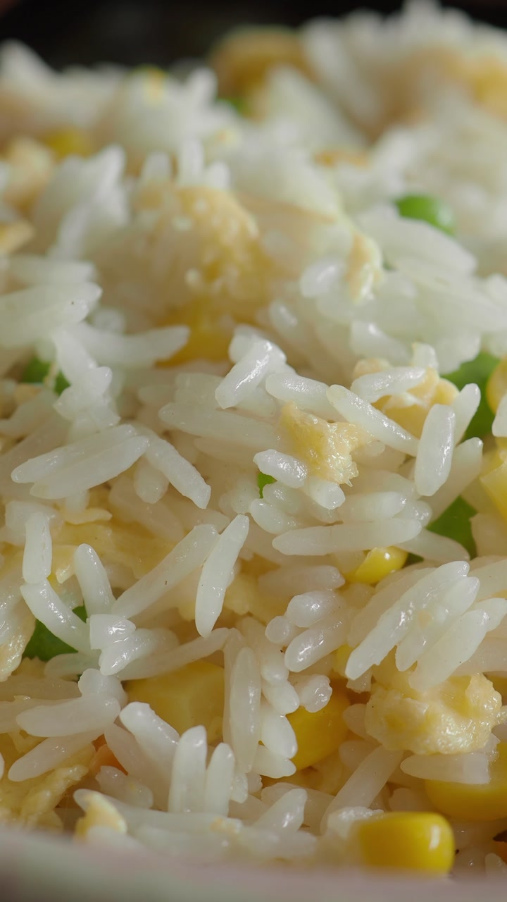 Close-up of Delicious Fried Rice with Corn, Peas, and Egg