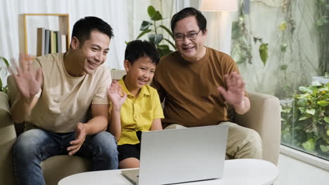 asian men and boy in the living room