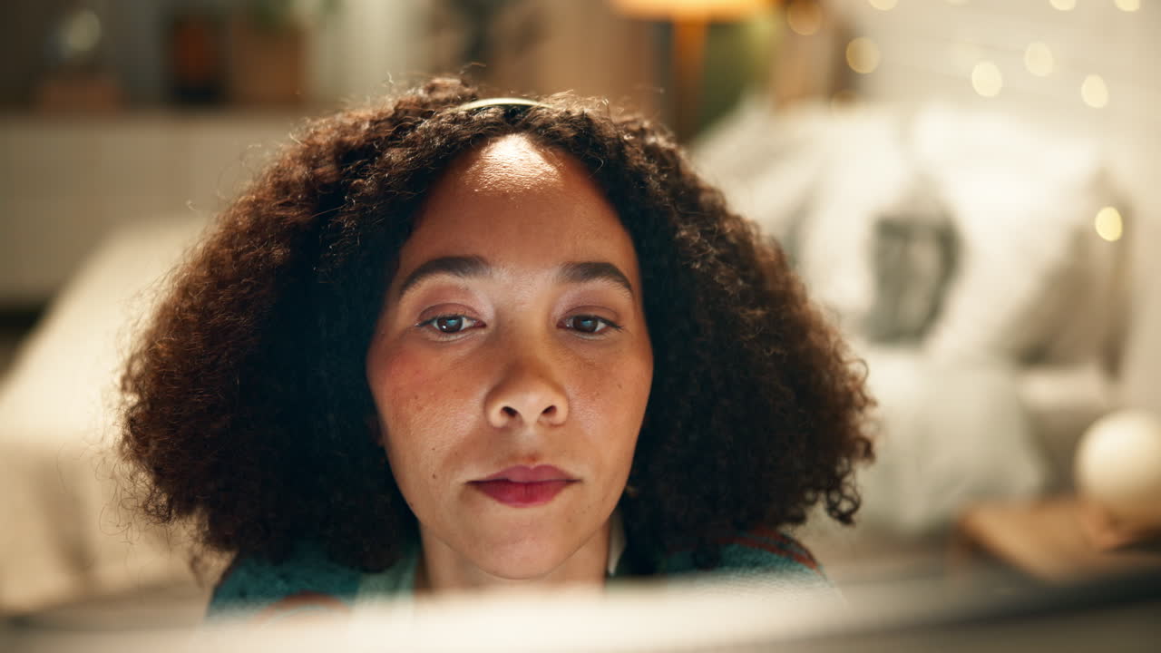 A woman with curly hair at home