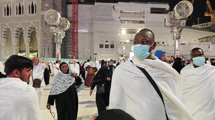 Pilgrims Walking in the Courtyard of the Grand Mosque in Mecca