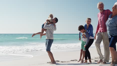 family enjoying free time on the beach together