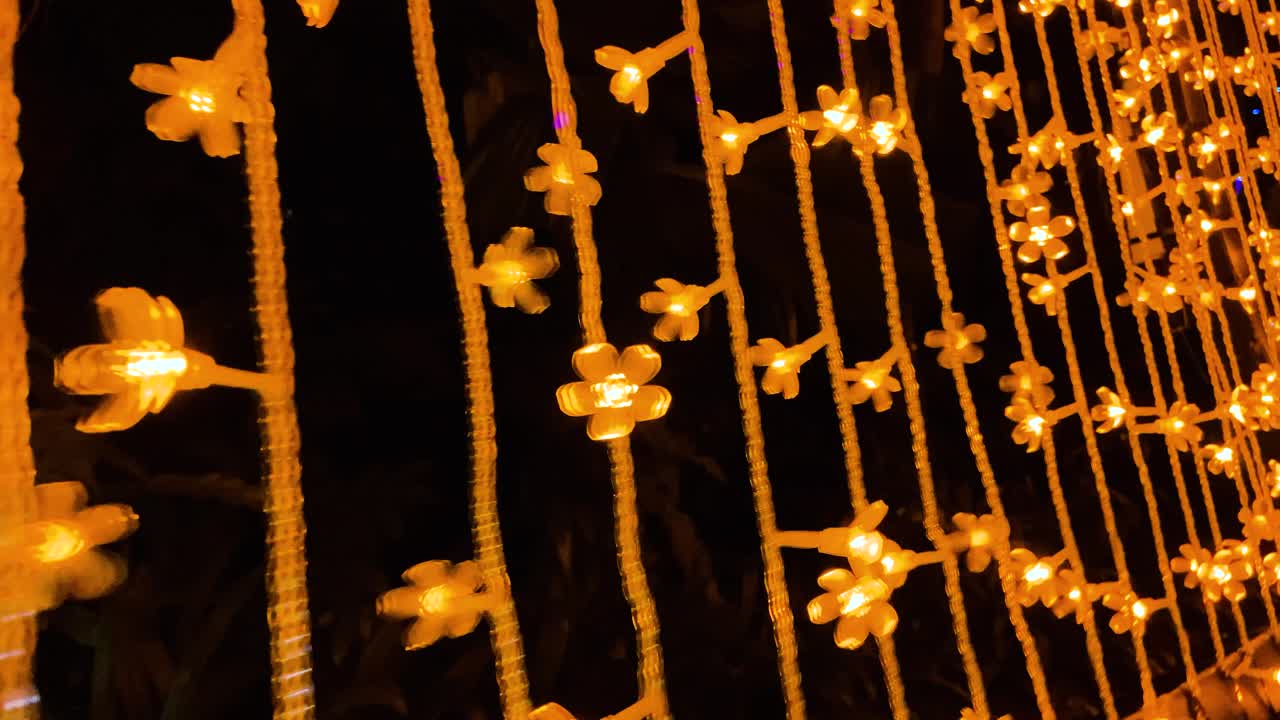 Close Up View Of Flower Christmas Lights At The Light Tunnel During Winter Wonderland Event At Gardens By The Bay In Singapore At Night. - rolling shot