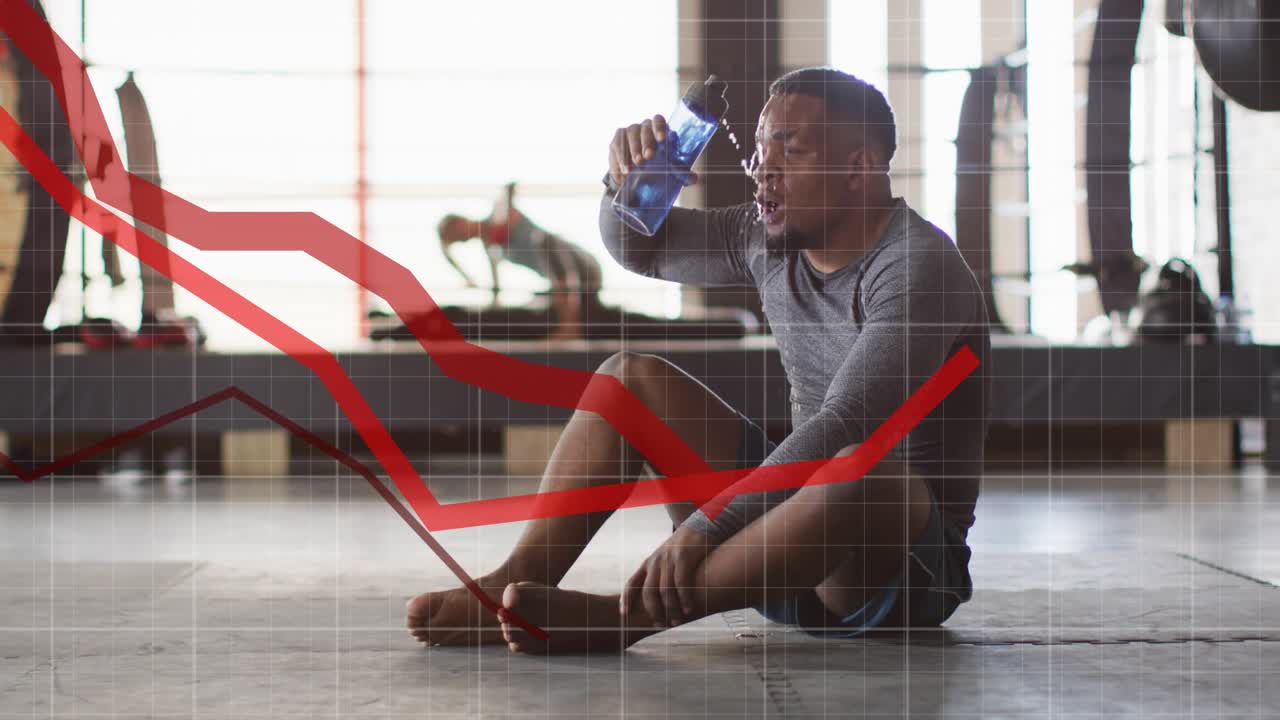 Man recovering from set in gym reaching blue bottle pouring and drinking, red graphs sweeping frame