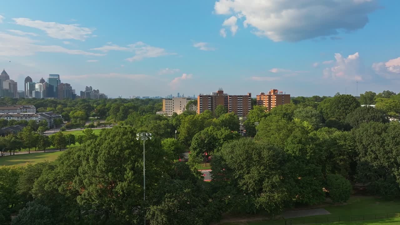 Urban green park with Atlanta city skylines in view, Central Park, Georgia, Drone