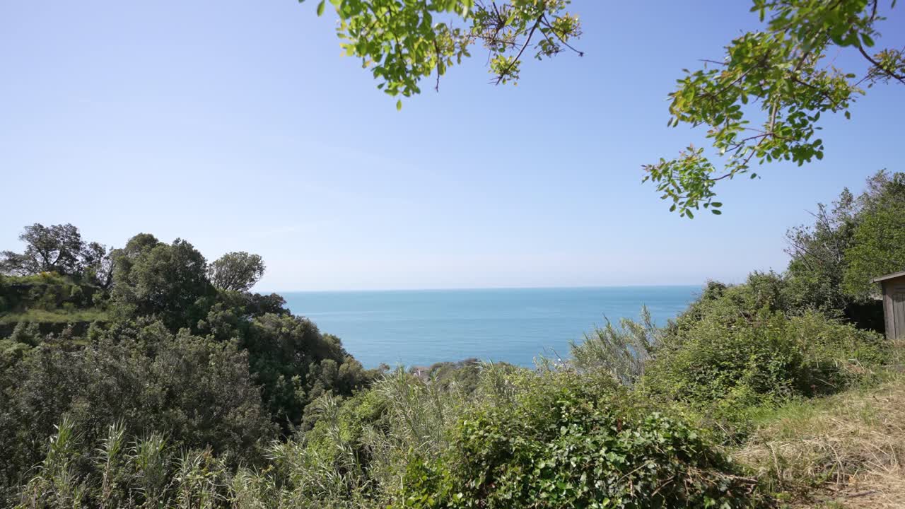 boy enjoying beautiful view of the sea in cinque terre, Italy.