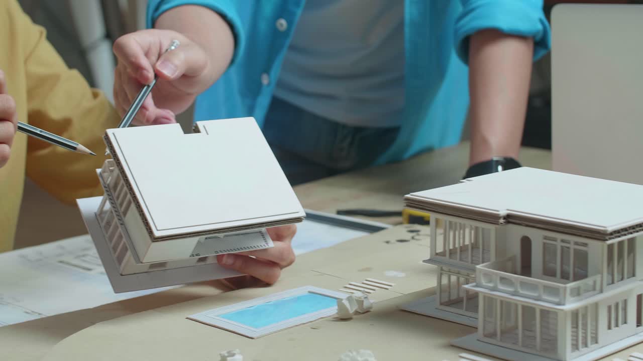 Architects Working on a House Model