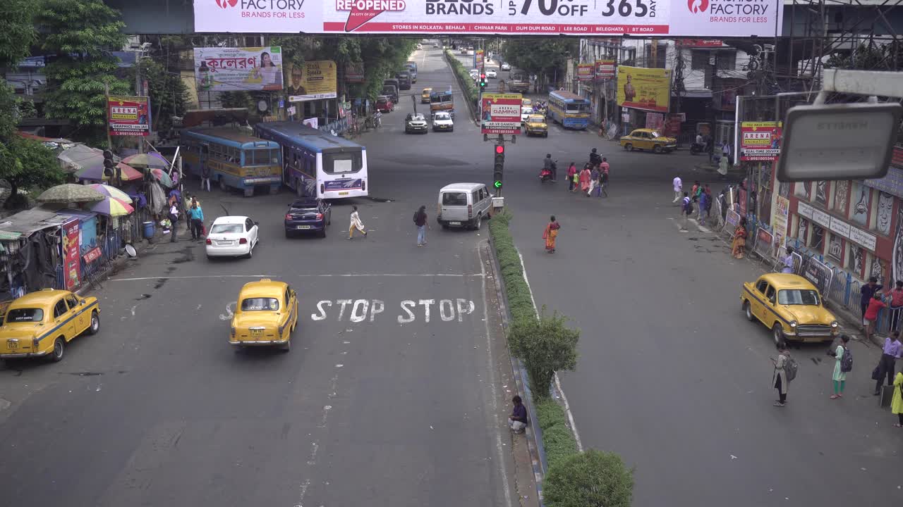 Stock footage of Kolkata street road and working people.