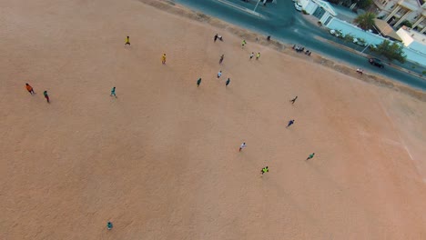 mesmerizing orbit around a spirited football match amongst players in jeddah, saudi arabia