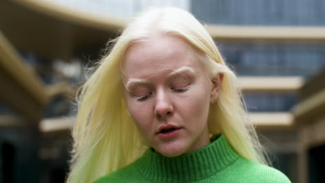 young woman holding earpods case