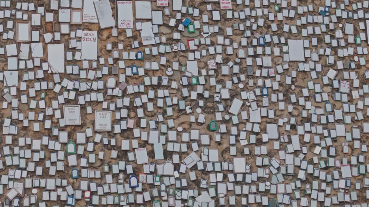 An artistic installation of thousands of mirrors decorates the roadside wall along the Banepa–Bardibas Highway, blending safety, design, and visual uniqueness on Nepal’s hilly road infrastructure.