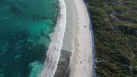 vehicle driving along wylie bay rock beach, esperance area in western australia