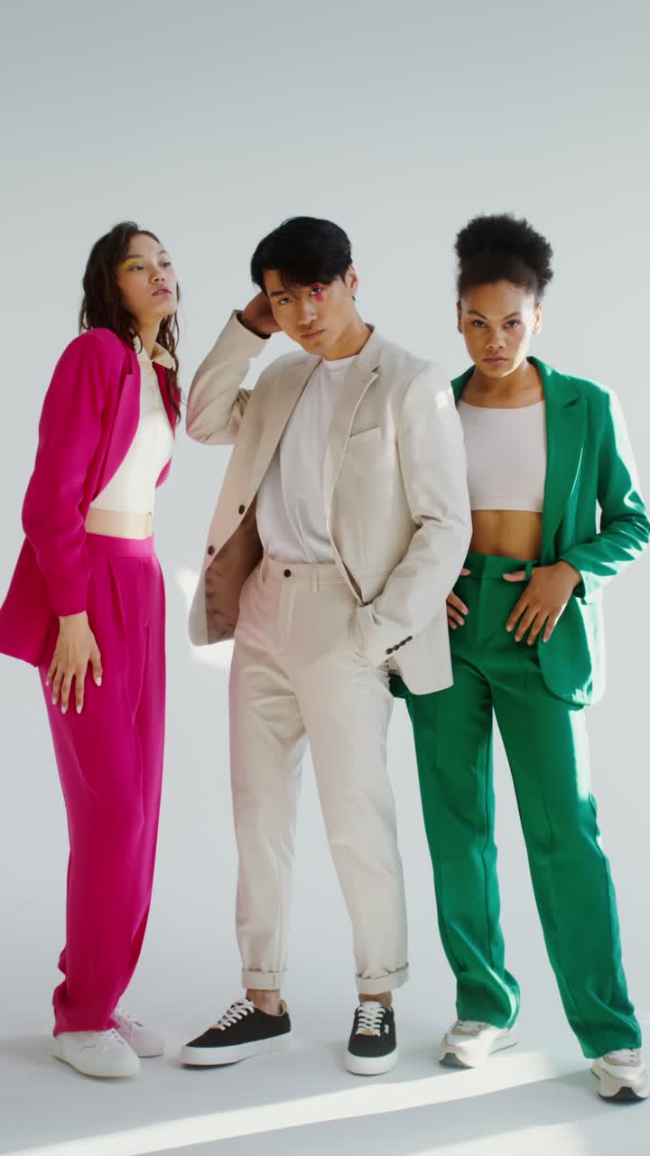 Group of people wearing colorful suits