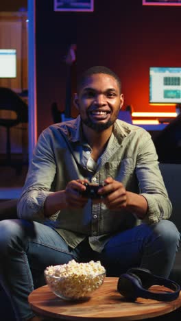 vertical video cheerful confident person winning the video games championship