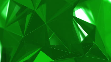 polygonal green elements. abstract looped animation of triangles. shiny moving surfaces with white glowing lines.