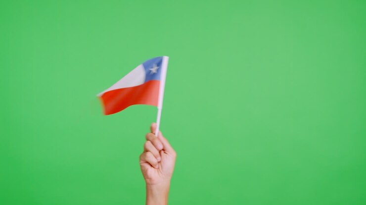 Hand waving a pennant of a chilean national flag