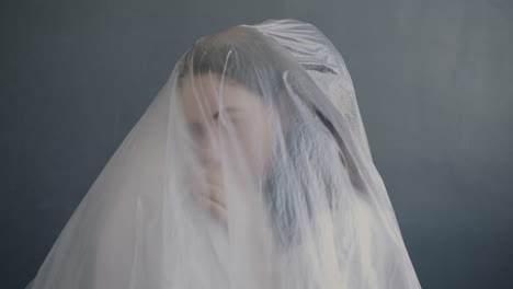 woman covered in plastic