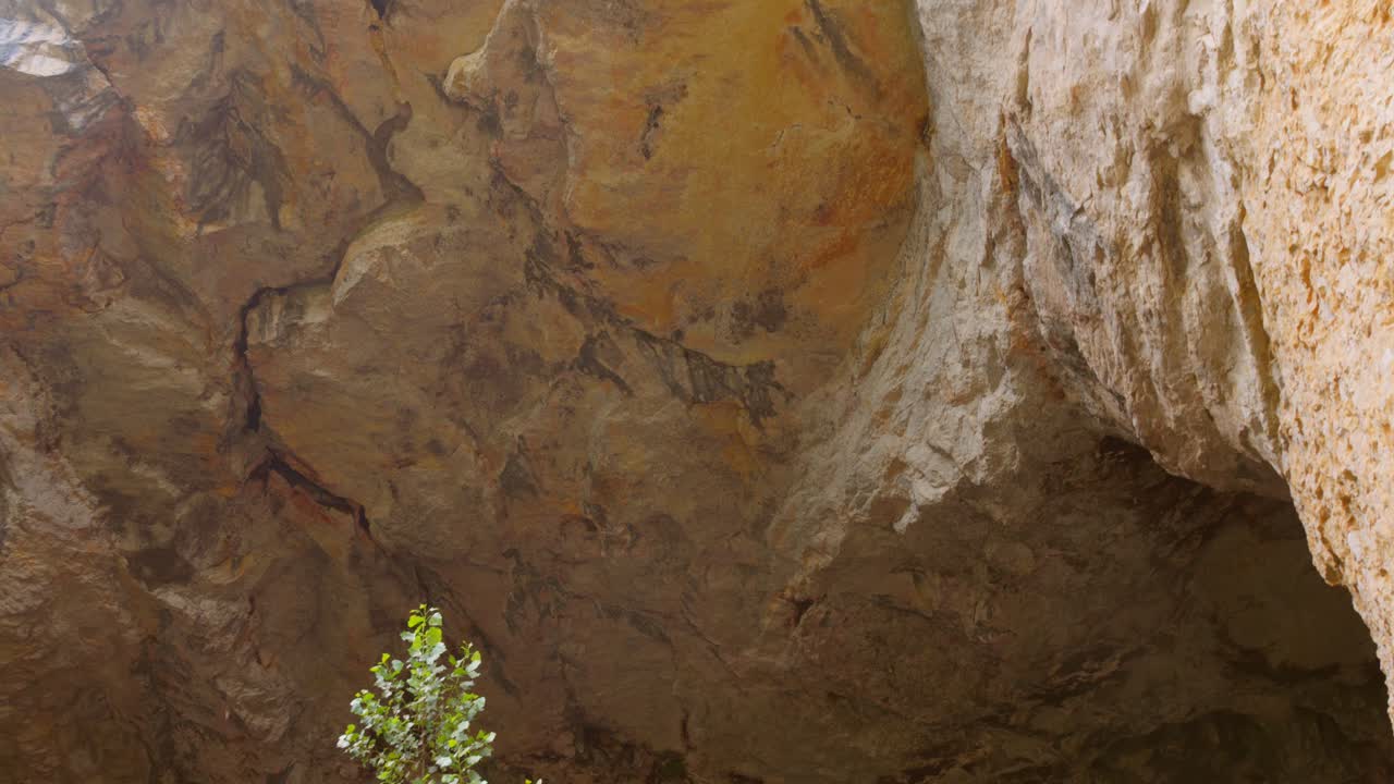 Close up of the limestone roof inside Grotte du Mas d’Azil, France, highlighting natural textures and geological formations