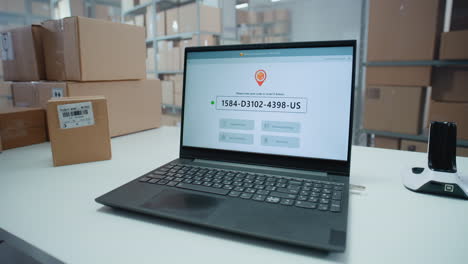 warehouse shipping process with laptop and tracking software