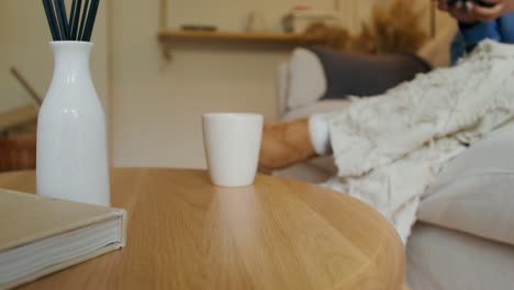 cozy living room scene with headphones and coffee