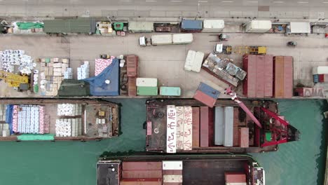 small feeder type container barges operating in hong kong pillar point dock